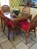 Rattan glass top table & four chairs