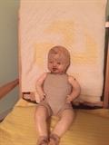 1920's porellin doll with antique baby blanket
