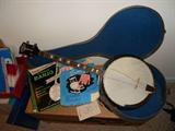 Harmony Roy Smeck Banjo plus case and books.