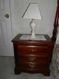 There are two of these night stands that match the bedroom suite.
