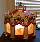 Musical silhoutte turning Merry go Round