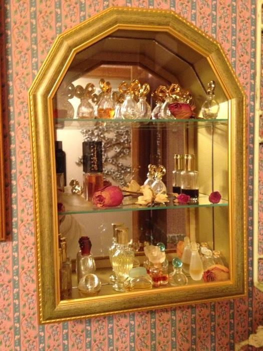 Nice perfume bottle collection.  Shadow box with mirror display cabinet