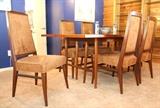 Mid-century dining room table with 2 leaves and 6 chairs in immaculate condition.