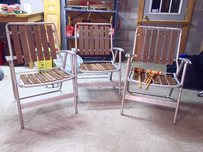 Aluminum, redwood slat set.  Two folding chairs and one rocking chair.