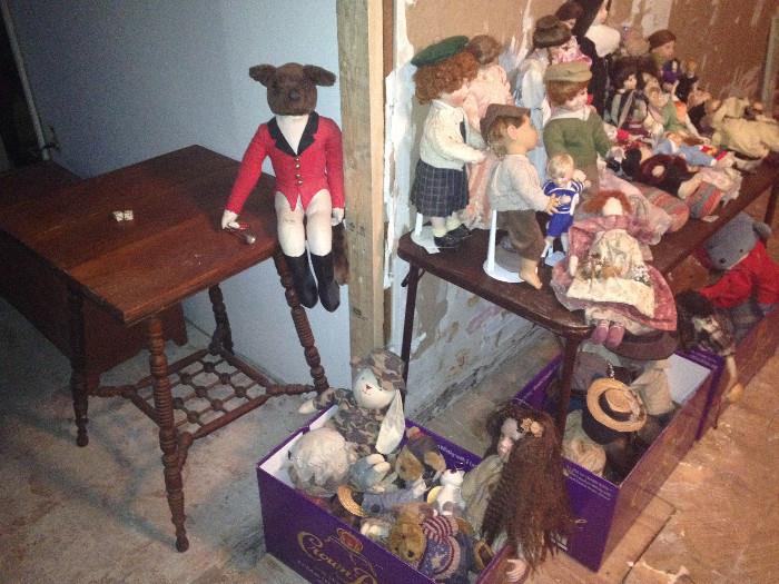 More dolls and stuffed animals -- "huntsman" sitter with horn on table