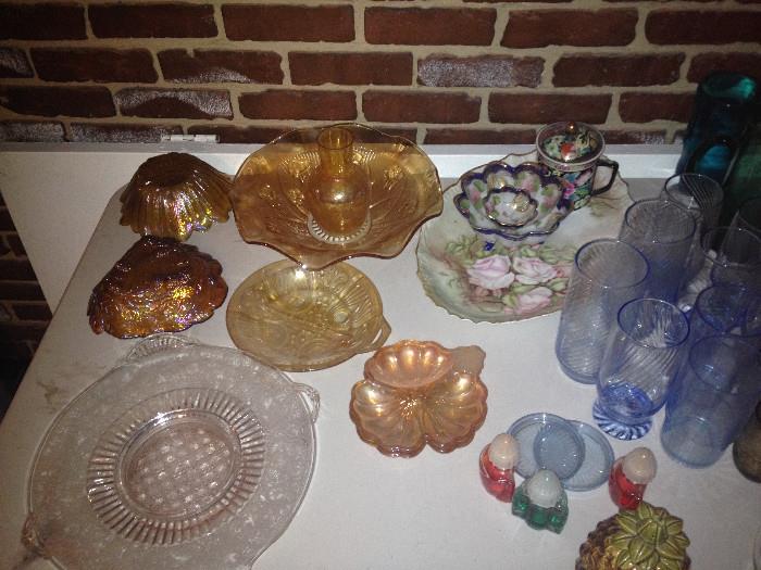 Carnival glass candy dished, Iris Depression glass ruffled bowl, front corner are two server trays in etched glass