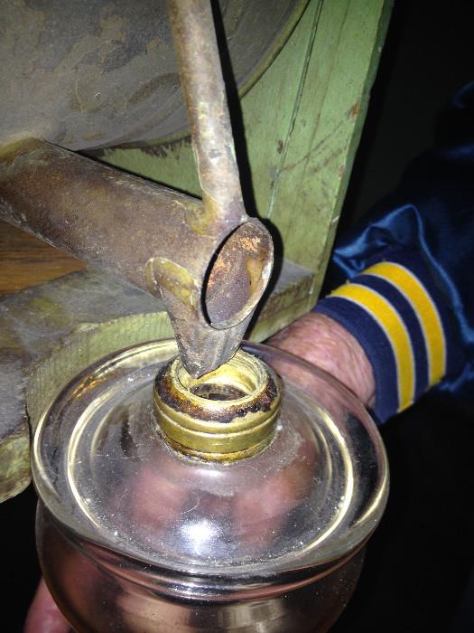 Close up of spout and hole that was used to get liquid into lantern