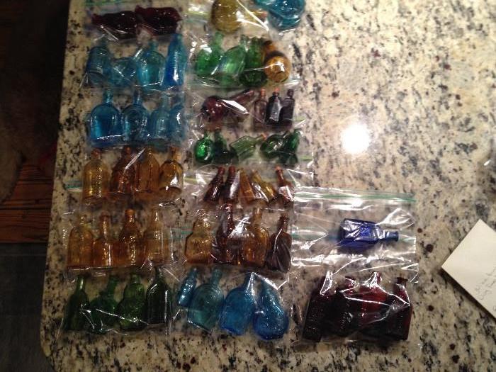 Collection of very small and miniature bottles red, green, amber, blue, purple