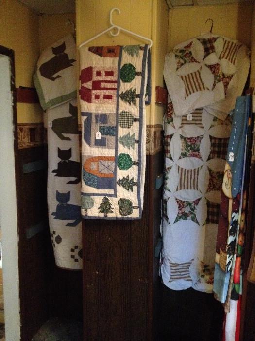Cat silhouette quilt with 2 shams (left), Tree border quilt (center) and another well made quilt with 2 shams (right)