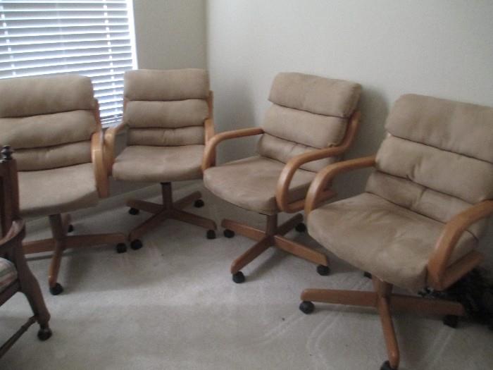 Set of 4 chairs on wheels.