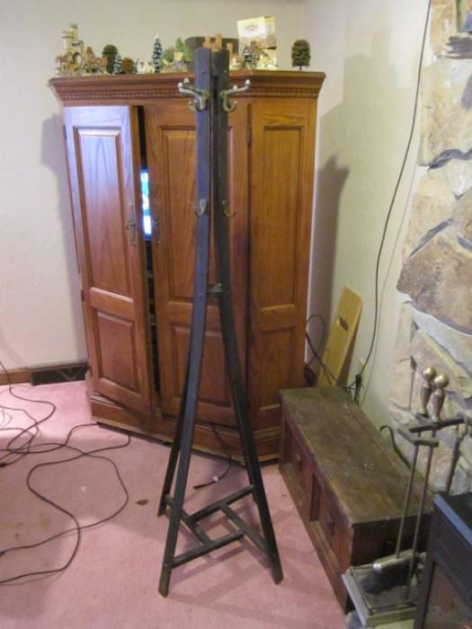 Mission period coat rack, Corner entertainment ctr., wood box. David Winter cottages on top of entertainment center.