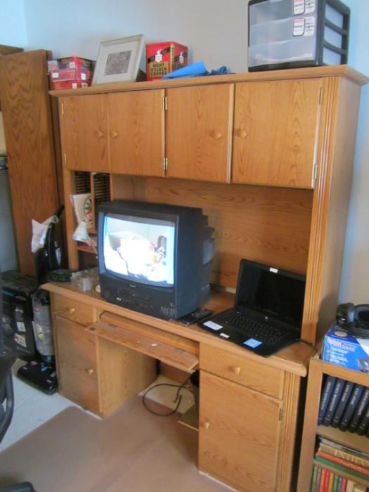 Two piece oak cabinet, laptop, small color tv and etc.