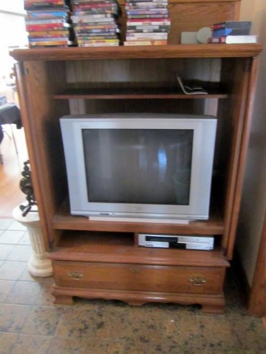 Entertainment center, TV, and cassette player.