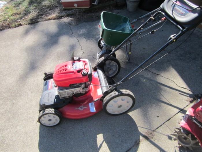 New, never used Troy Bilt self propelled law mower and deluxe  spreader