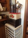 white metal storage cart with basket drawers, bread boxes, canister set & bun warmer