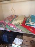 quilts, luggage, boxes of fabic