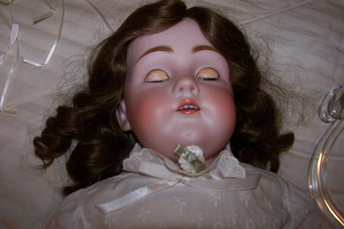 Antique doll - her arms and legs are jointed with a leather body.  She is in excellent condition