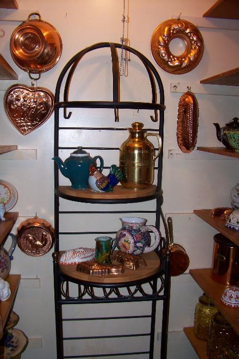 Kitchen closet full of copper, kitchen items, molds, teapots, etc.