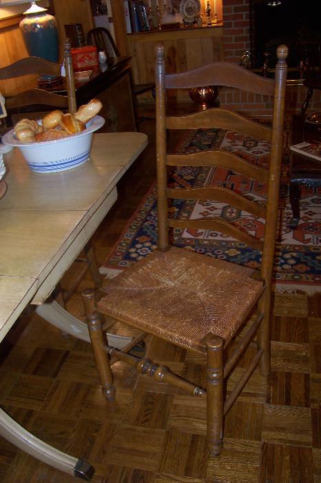 One of a set of 4 ladder back chairs