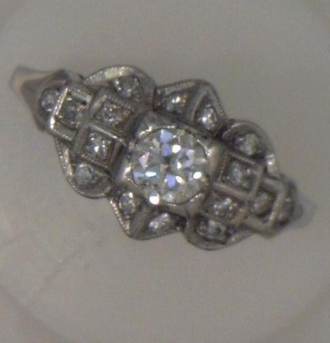 Antique Platinum ring - C. 1930-1940, European cut center diamond (.39 ct). Center stone surrounded by 16 single cut diamonds (total weight of small diamonds is .16 ct). Color is G-I - 2012 appraisal was $2,800.00 by Cronier's Jeweler