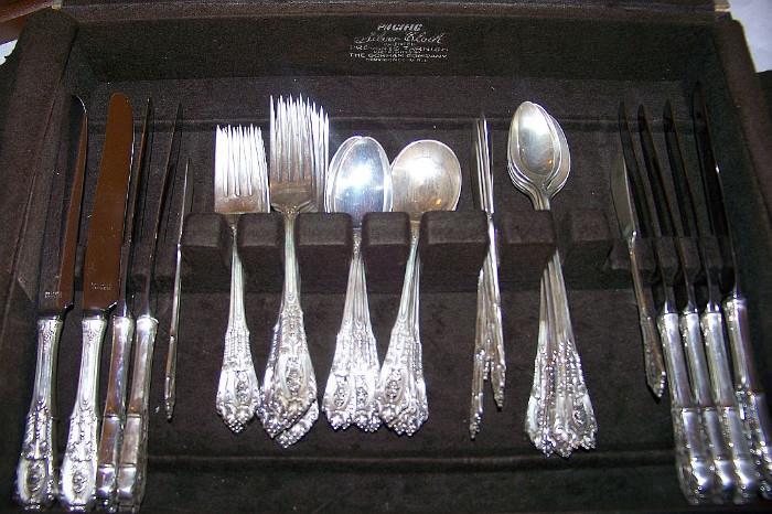 "Rose Point" sterling by Wallace - Service for 8 including knifes, dinner forks, salad forks teaspoons, ice tea spoons and butter spreaders.  We also have many serving pieces in this pattern