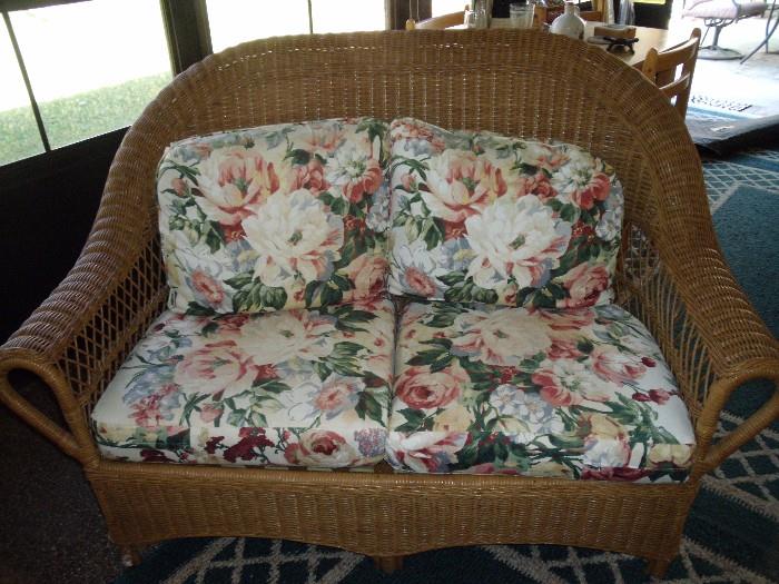 natural wicker love seat with cushions