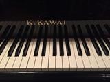 K. Kawai black lacquer baby grand piano