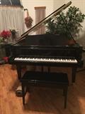 K. Kawai black lacquer baby grand piano
