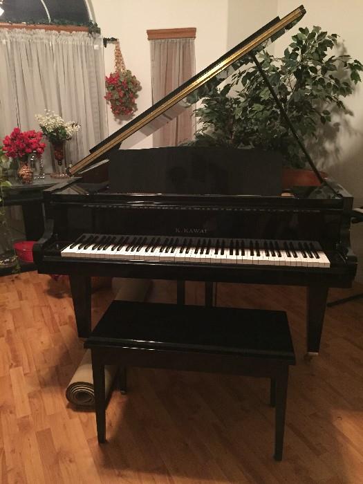 K. Kawai black lacquer baby grand piano