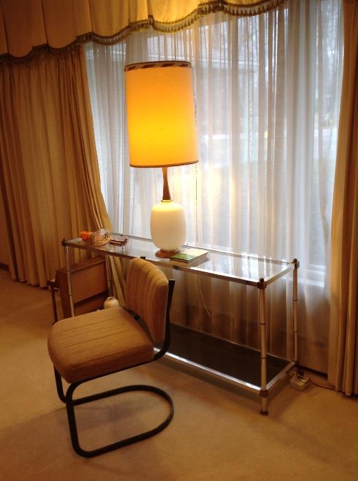 glass and chrome sofa table, cool lamp, and one of the chairs matching a glass top dining table