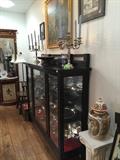 Antique china cabinet filled with silverplate serving pieces, 