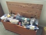 Cedar chest and bags of yarn