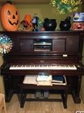 Starck player piano, bench with rolls. Sells as a set, we will not break it up! Also includes 54 player rolls!