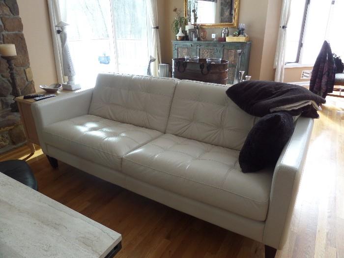 Bloomingdale's soft white sofa.  Supple, comfortable leather. Being sold for a FRACTION of their original cost.  Come take a look.