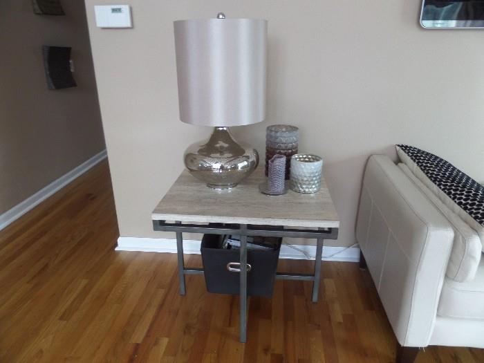 One of a pair of travertine topped end tables. See the mercury glass lamp?  There is a pair of them.  Designer quality. 