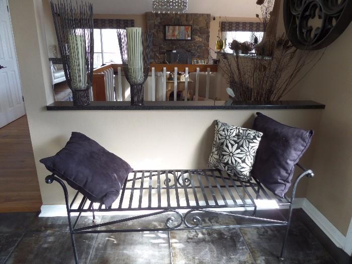 Black wrought iron bench.  Versatile piece, goes with all decors.  Can be used indoors or outdoors.  Heavy iron. Quality piece.