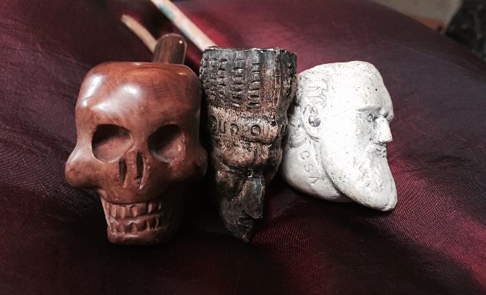Carved Skull pipe, two clay pipes: Robert E Lee and Redcloud.  The latter two most likely from the historic Pamplin Pipe Company in Pamplin, VA. 