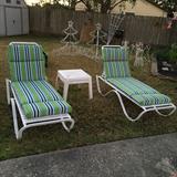 Loung chairs with cushions and Christmas yard decorations. 