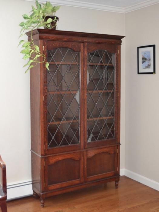 Oak cabinet with leaded glass doors