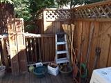 Variety of Garden Tools, Wood Room Divider, Ladder, Tiki Torches, Planter Tools and Pots.