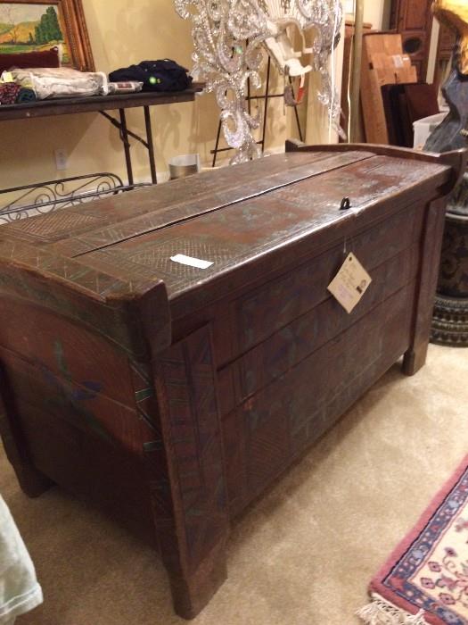 Antique Eastern European blanket chest...is painted with geometric design.  Quite heavy.