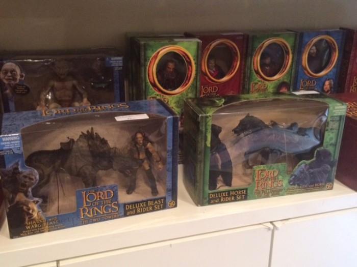 Numerous Lord of the Rings action figures, still in box.