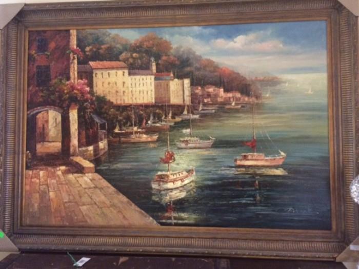 Very large (approx 5' x 7') burnished gold framed oil painting of a cheery village Mediterranean seaside scene with sailboats in the foreground.