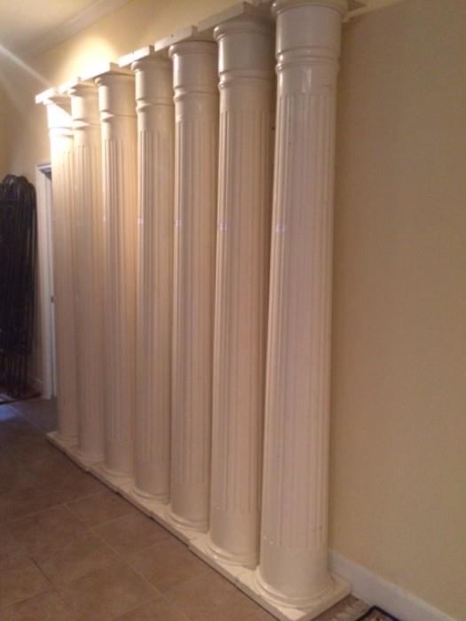 Seven antique matching interior fluted wood columns, approximately 8'1'' tall by 14" wide at base and top.