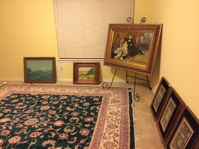 Various oil paintings and one of several vintage decorative rugs