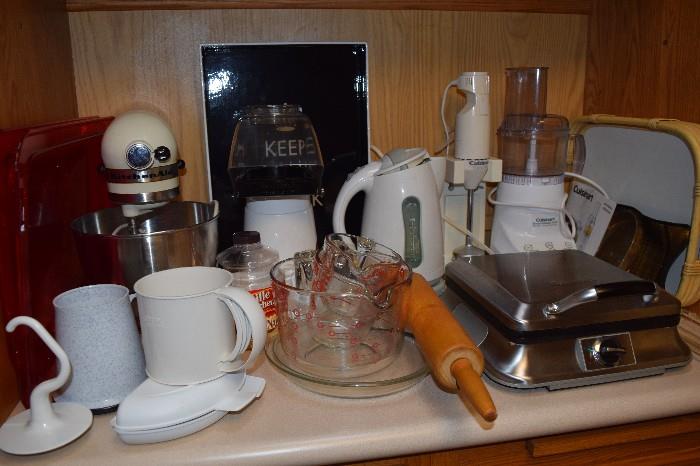 Small kitchen appliances including a waffle maker and Kitchen Aid