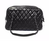 RARE CHANEL SHOPPER in black quilted calfskin in excellent condition. Soft, black, quilted calfskin leather exterior trimmed with a double zippered top closure and gunmetal hardware. Black nylon interior holds 1 side zippered pocket, 1 cell phone pocket, and 1 side slit pocket with plenty of storage space for all your essentials. This is a limited edition piece. It was only produced for 1 season and is no longer available in stores or online. No stains or smells. Clean corners, edges, and interior. Light scuffs on bottom exterior from use but they do not detract from the overall beauty of this piece. This is perfect for any occasion. It is the perfect size for daily use and will surely last your wardrobe a lifetime in classic Chanel style. 
Purchase includes a dust cover.
Measurements: 13''x8''x5.5'' 9'' handle drop

Free shipping for this item within the continental US.