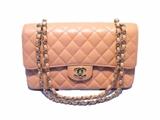 AMAZING Chanel peach caviar 2.55 double flap classic in excellent condition. Quilted peach caviar leather exterior trimmed with shining gold hardware. Double flap style twist CC logo closure opens to a matching peach leather lined interior with 3 slit pockets, 1 zippered "love note" pocket, and 1 lipstick pocket. No stains, smells, or scuffs. Clean corners, edges, and interior. Original papers and Authenticity card included. This is a very rare find in the popular 2.55 Chanel classic style as this peachy color was only produced for one season and never before seen in durable caviar leather. It is perfect for any occasion as it coordinates wonderfully with any wardrobe. 
Purchase includes a dust cover, papers, and Authenticity card.
Measurements: 10''x6''x2.5'' 9.5'' dbl shoulder drop 17'' single drop

Free shipping for this item within the continental US.