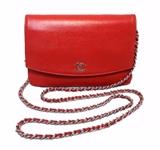 BEAUTIFUL CHANEL red wallet on a chain in excellent condition. Red caviar leather exterior trimmed with silver hardware and signature woven chain and leather shoulder strap. Single flap snap closure opens to a red leather and beige nylon lined interior that holds plenty of credit card slit pockets. 1 slit pocket, 1zippered coin purse pocket, and just the right amountof space for your essentials. This piece is in excellent condition. No stains, smells, or scuffs. Clean corners, edges, and interior. This piece is perfect for daily use as it carries all your belongings in classic Chanel style. The fabulous red color brightens any wardrobe in any season. 
Purchase includes a dust cover.
Measurements: 7.5"x5"x1" 25"strap drop

Free shipping for this item within the continental US.