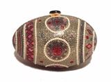 RARE JUDITH LEIBER Swarovski crystal and pearl faberge egg minaudiere in excellent condition. Multi-color swarovski crystal adorned exterior trimmed with pearls in a beautiful faberge egg design. Top black button closure opens to a gold leather lined interior that holds an attached gold chain shoulder strap. This piece is in excellent condition. No stains, smells, scuffs, or missing crystals/pearls. Clean edges and interior. This is a very special collectors piece that would make a wonderful addition to any wardrobe. Wear it to any formal occasion or keep it on display with other beautiful works of art. This piece will surely start conversations and only increase in value as the seasons pass by. 
Purchase includes a dust cover, coin purse, pocket mirror and comb and original manufactures card
Measurements: 6.5"x4"x4" 20" strap drop

Free shipping for this item within the continental US.